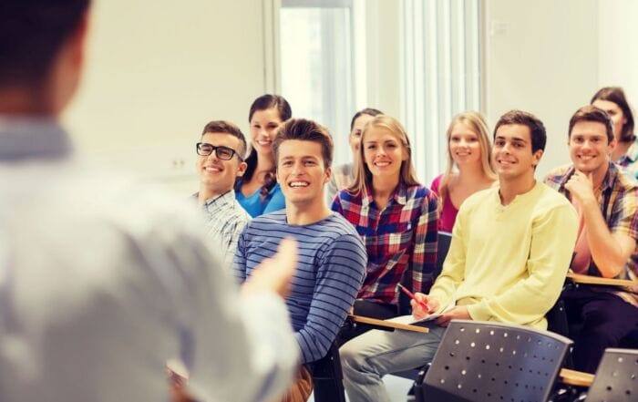 High school students learning peer tutoring skills in a classroom setting